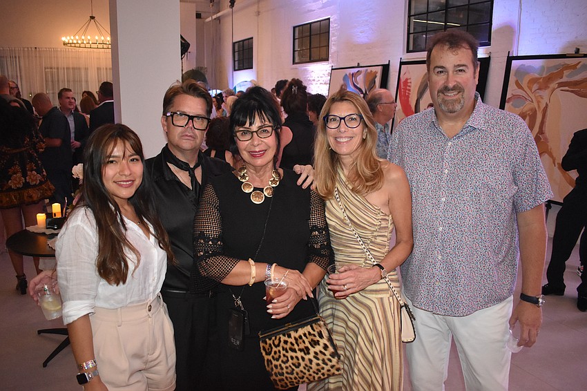 Yolanda Mizama, Gregory Hoffman and Ana Molinari, and Susan and Greg North, enjoy the event together.