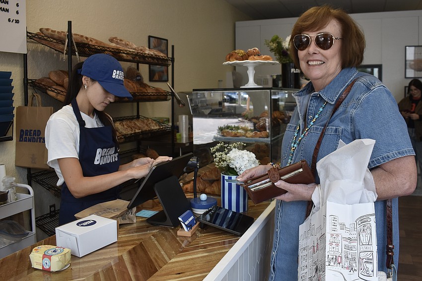 Arcadia's Joyce Blackmon picks up some French butter and pastries before visiting with her daughter at The Lake Club.
