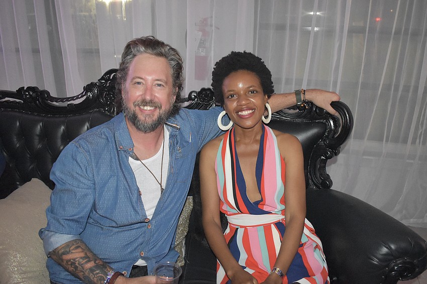 Greg Pennenga and Rebecca Adesanya socialize.