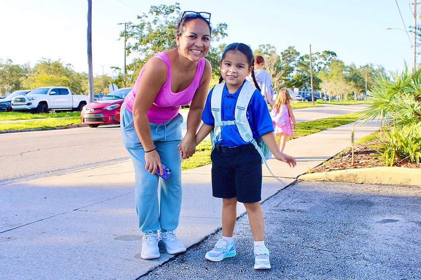 Julissa Velasquez sees 5-year-old Mia Guedes off to her first day of school at Alta Vista Elementary on Monday.