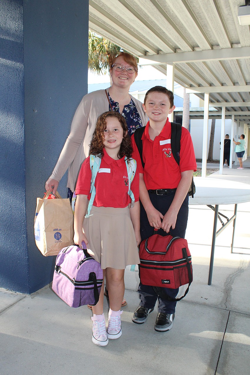 Wyatt, 5th grade, and Lillian Hill, 3rd grade, have their bags packed and ready to go before Priscilla bids them a good first day of school at Alta Vista Elementary School.