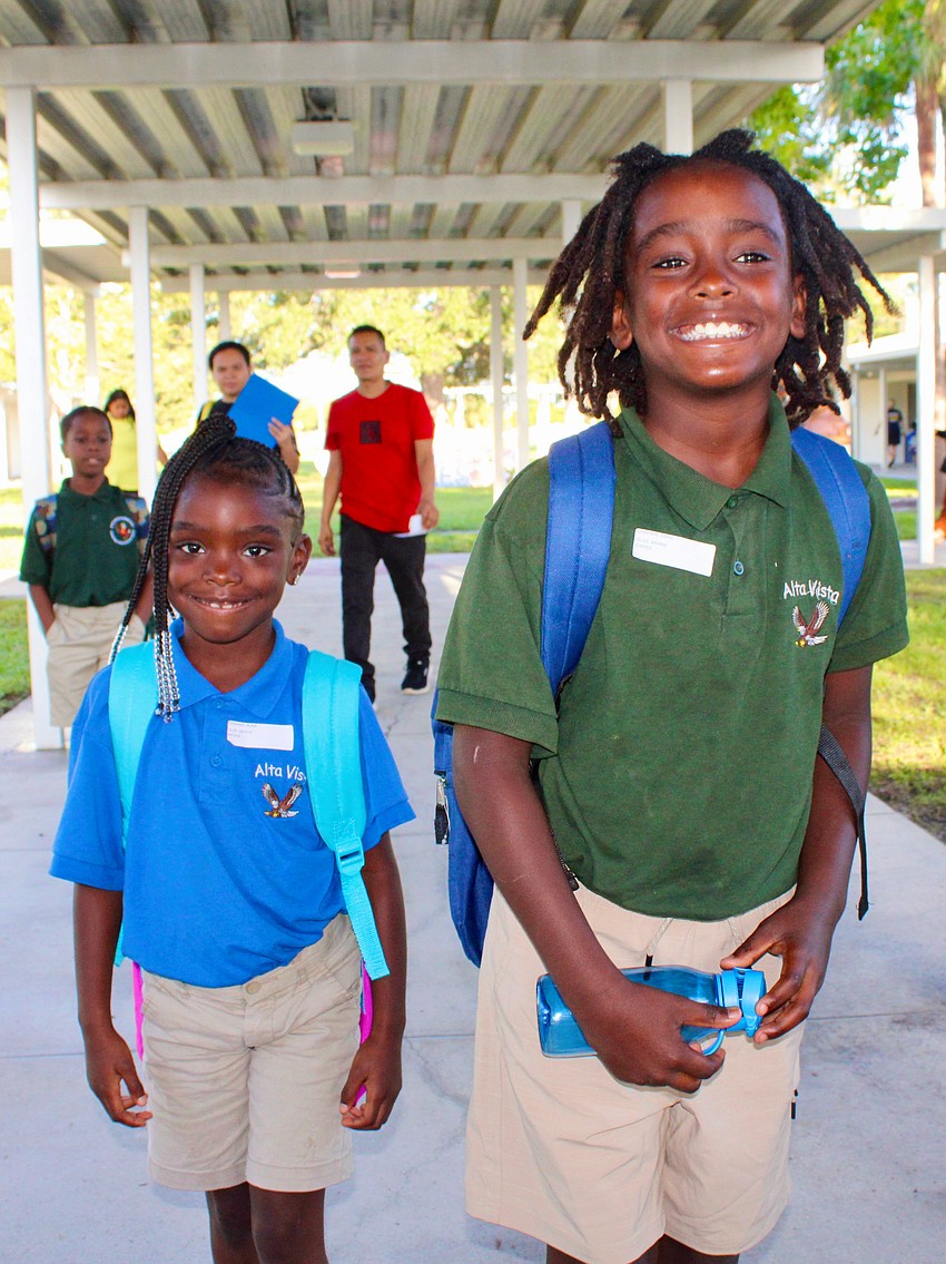 Alia and Zaire Graham, respectively entering first and third grade, have bright smiles for the first day of school at Alta Vista Elementary School.