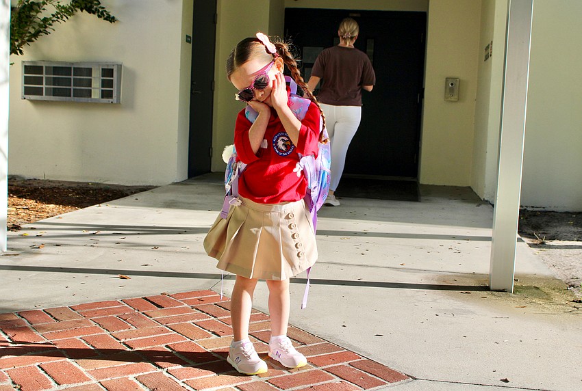 Kindergartener Jazmyn Garcia, who is 5 years old but won't be for much longer considering her birthday is coming up this month, showcases her spiffy sunglasses she wore for the first day of school at Alta Vista Elementary School. Her mother, Maria Santiago, said Jazmyn has been looking forward to it all week.