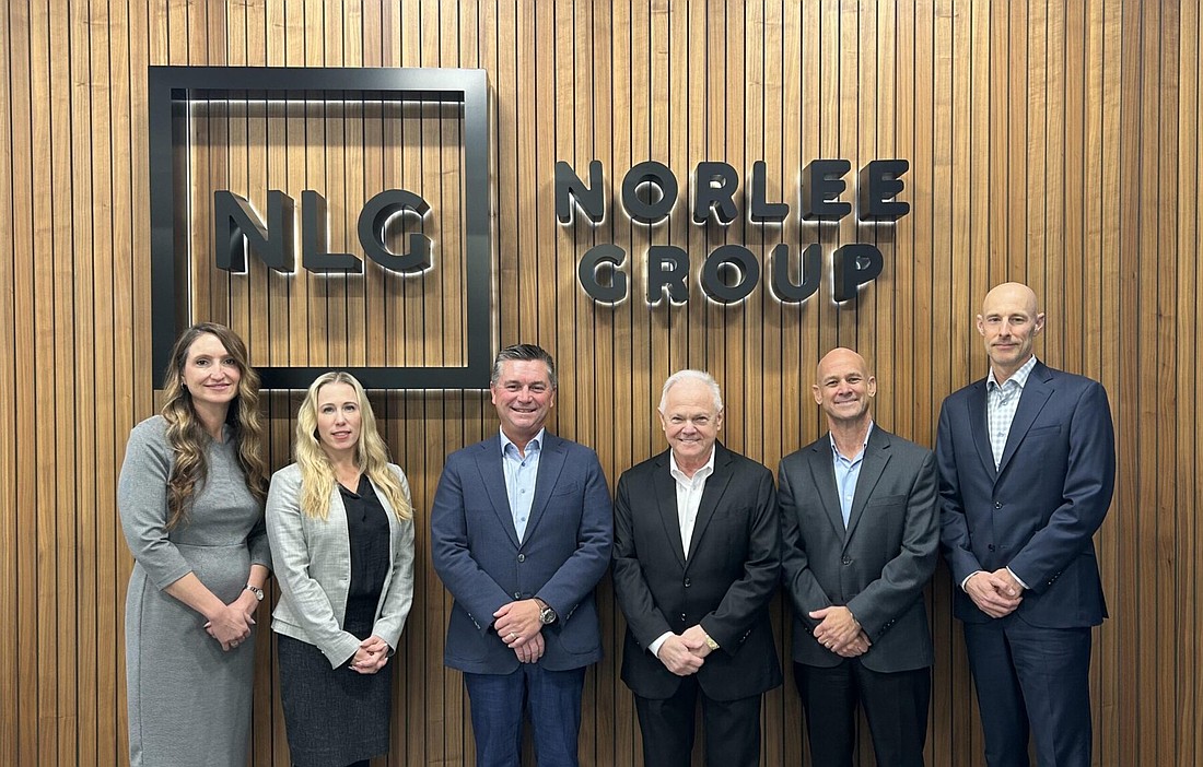 Norlee Group's executive team, including CEO Wally Budgell, third from left. Budgell said Vintage Electric's "reputation for quality workmanship, trusted customer relationships, and a people-first approach to business" made the recently announced acquisition "a natural fit."