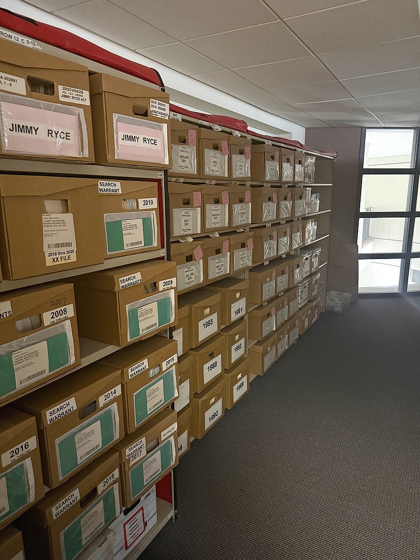 Legal documents and other records are stacked in boxes inside an office at the Sarasota County Historic Courthouse. Legal documents and other records are stacked in boxes inside an office at the Sarasota County Historic Courthouse.