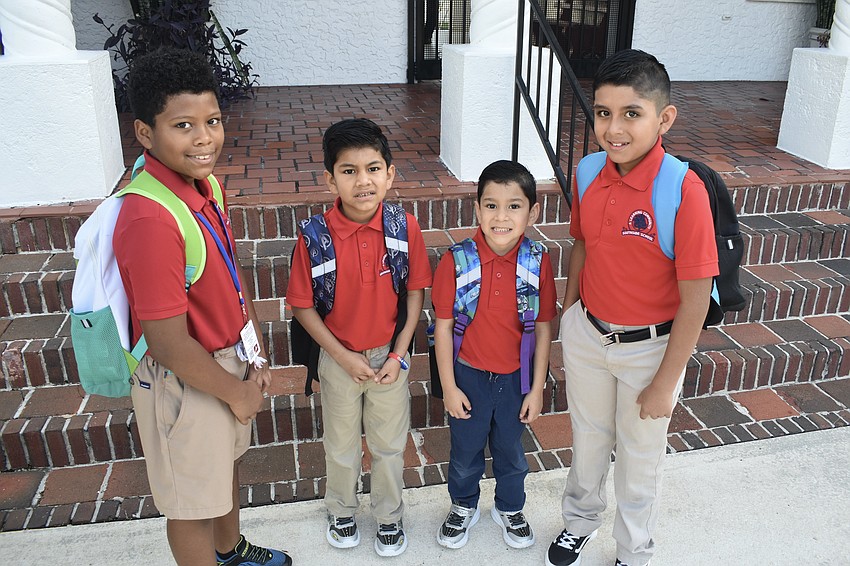 Siblings Adrian McKenzie-Deanda, a fifth grader; Armando Ramirez, a first grader; Giovanni Ramirez, a kindergartener; and Alex Ramirez, a second grader, prepare to enter Southside Elementary.