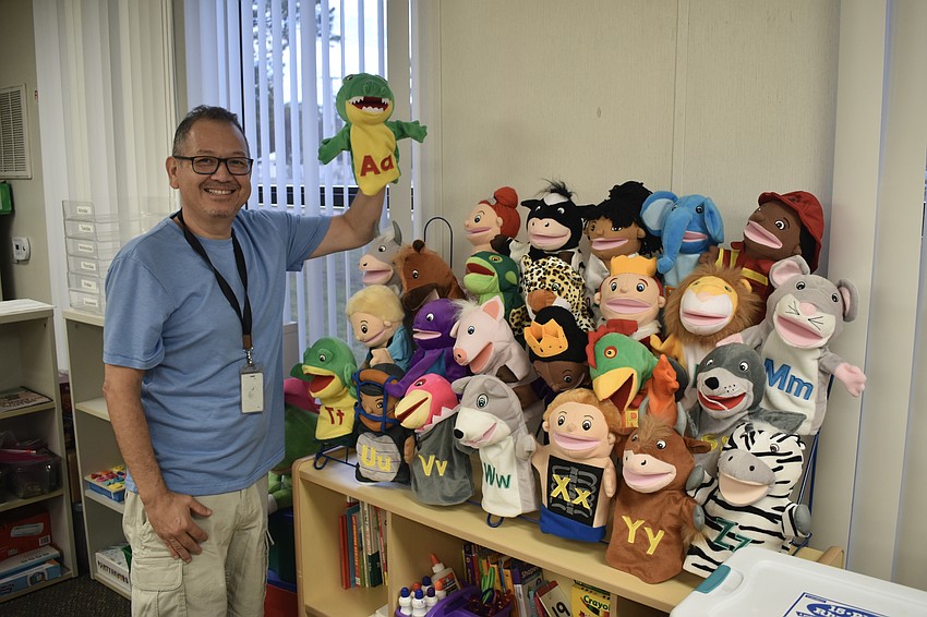 Diego Balcazar, who teachers Pre-K students who have varying exceptionalities at Tuttle Elementary, had his series of alphabet-themed puppets arranged for students.