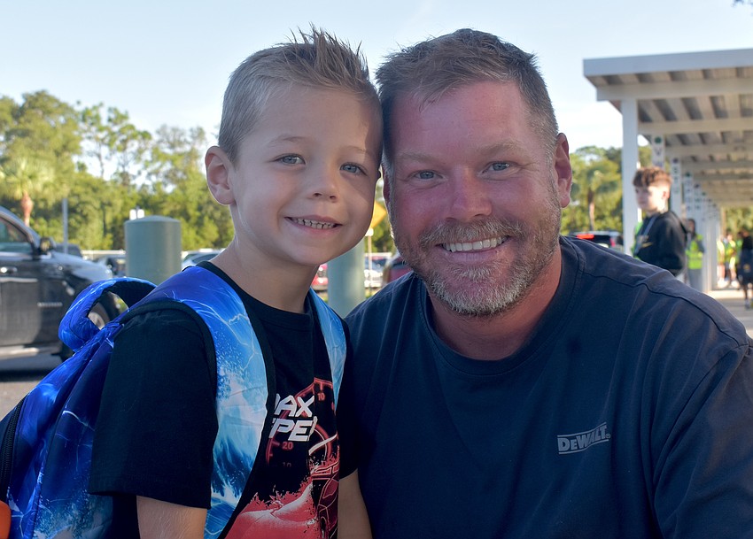 Kindergartener Bahn Macke, who is excited to start school to understand how things work, is dropped off by his dad, Tyler Macke.