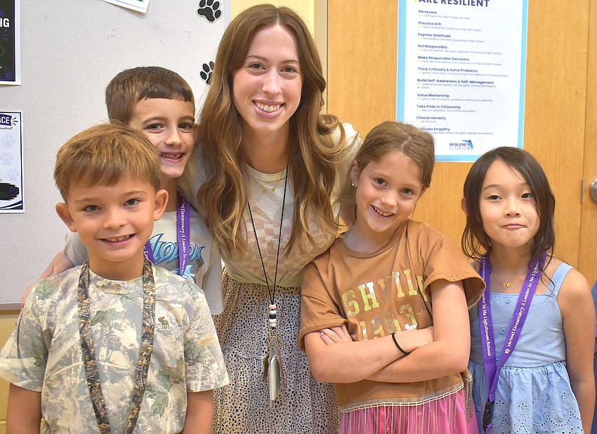 Beau Taylor, Callen Scherzer, Jesse Plummer and Mila Park are happy to have another school year with Bella Rubal as their teacher.