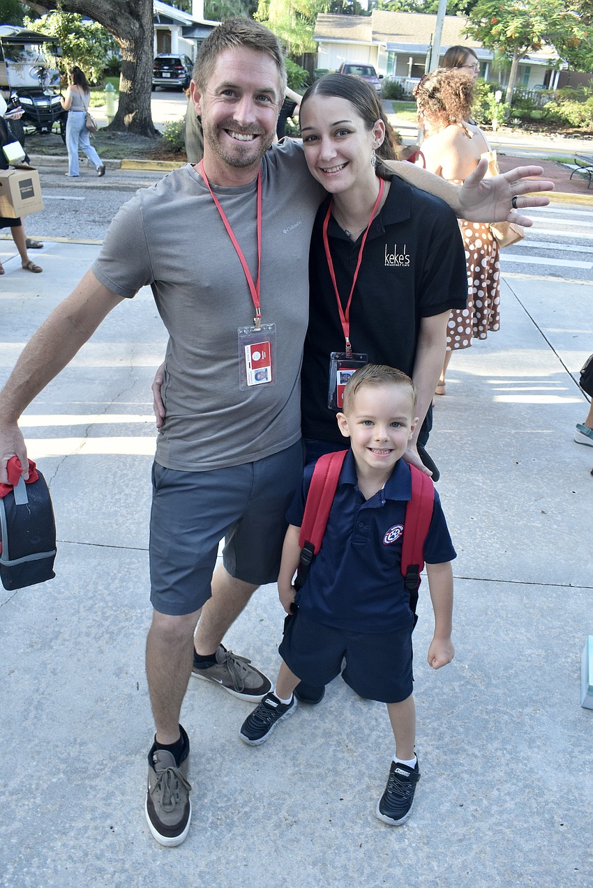 Stephen Hecht Jr. (center) strikes a first-day-of-kindergarten pose with his parents Stephen and Jennifer Hecht.