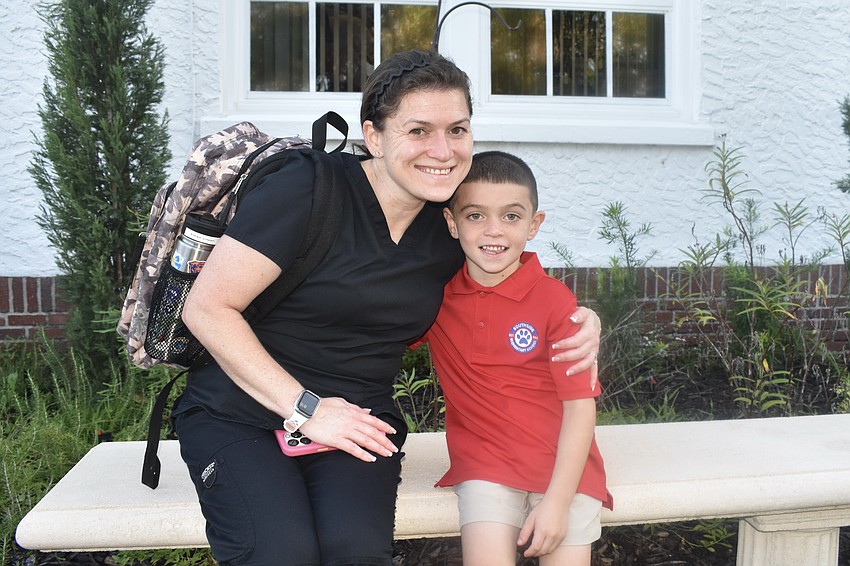 Brittany Raszka sits with her son Ethan Litzell, who is entering first grade.