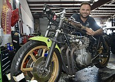 Mark Salle-Tabor poses with what could be a record-setting 1978 Kawasaki KZ650. It bears the name "Wasabi" because of his father, Aaron Tabor.