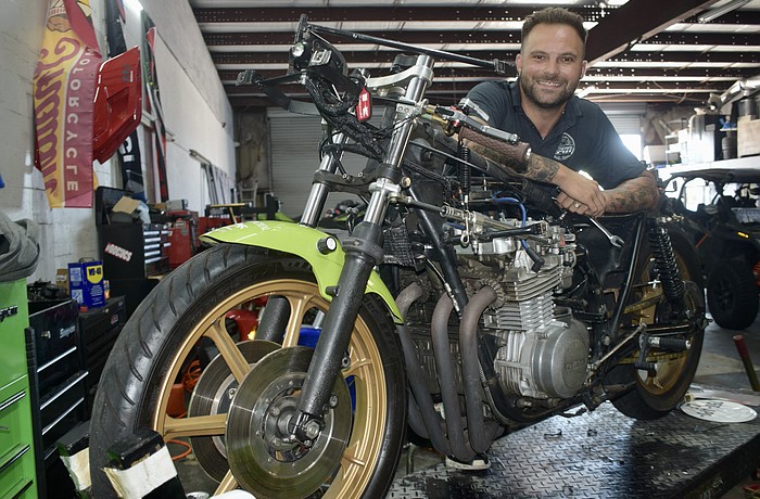 Mark Salle-Tabor poses with what could be a record-setting 1978 Kawasaki KZ650. It bears the name "Wasabi" because of his father, Aaron Tabor.