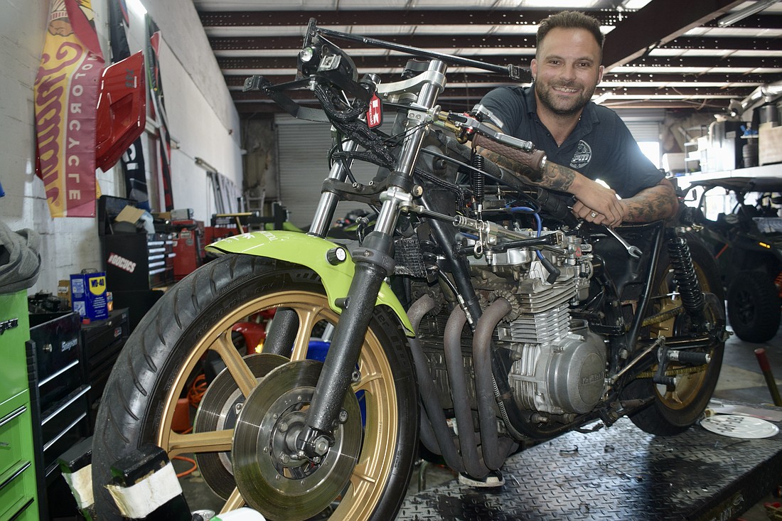 Mark Salle-Tabor poses with what could be a record-setting 1978 Kawasaki KZ650. It bears the name "Wasabi" because of his father, Aaron Tabor.