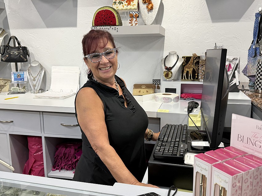 Darci Jacob, owner of Darci boutique on Main Street, said she has cut back on employee hours in part because of the now-rescinded extension of parking enforcement. Darci Jacob, owner of Darci boutique on Main Street, said she has cut back on employee hours in part because of the now-rescinded extension of parking enforcement.