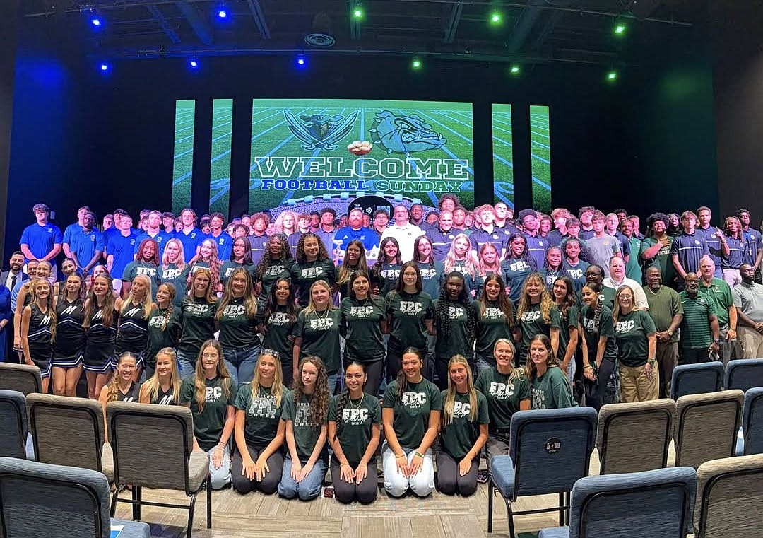 Football players and cheerleaders from FPC and Matanzas high schools pose for a group picture at Palm Coast United Methodist Church. Courtesy photo
