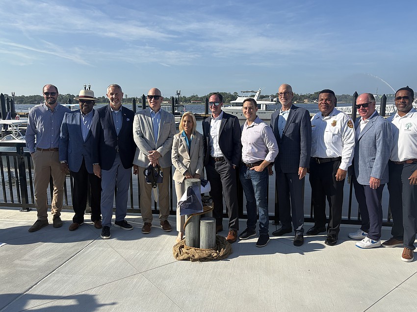 City leaders celebrate the ribbon-cutting of Met Park Marina on Aug 12.