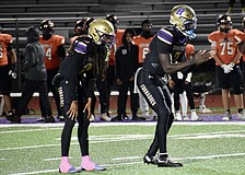 Former Booker football players Jacobey Mobley (left) and Joel Morris (right) are pictured during a game in 2025. The Tornadoes are under administrative probation for their upcoming season.