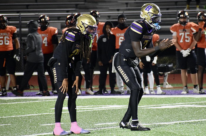 Former Booker football players Jacobey Mobley (left) and Joel Morris (right) are pictured during a game in 2025. The Tornadoes are under administrative probation for their upcoming season.