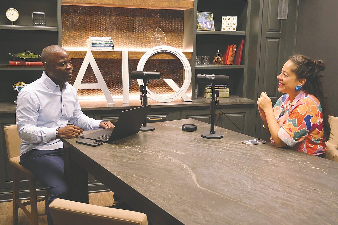 Carlton Robinson, chief innovation officer at the JAX Chamber, left, talks with Anamaria Contreras, executive director of the Jacksonville Chamber Foundation, during a recording session at the Chamber’s podcast studio.