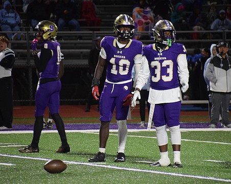 Former Booker football players Kevontay Hugan (10) and Le'Darien Smith (33) are pictured during a game in 2025. The Tornadoes will not compete in any varsity football games this fall.