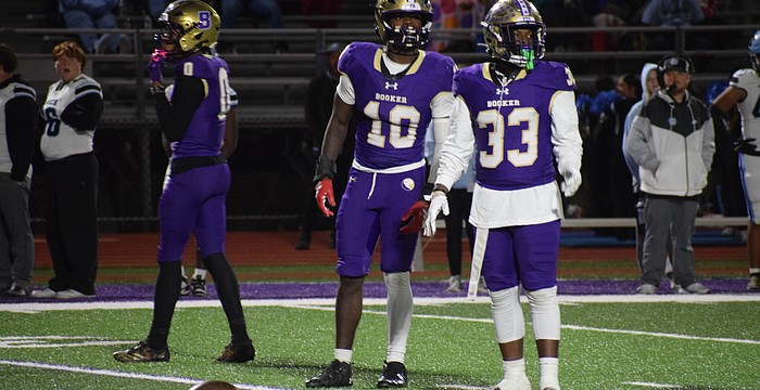 Former Booker football players Kevontay Hugan (10) and Le'Darien Smith (33) are pictured during a game in 2025. The Tornadoes will not compete in any varsity football games this fall.
